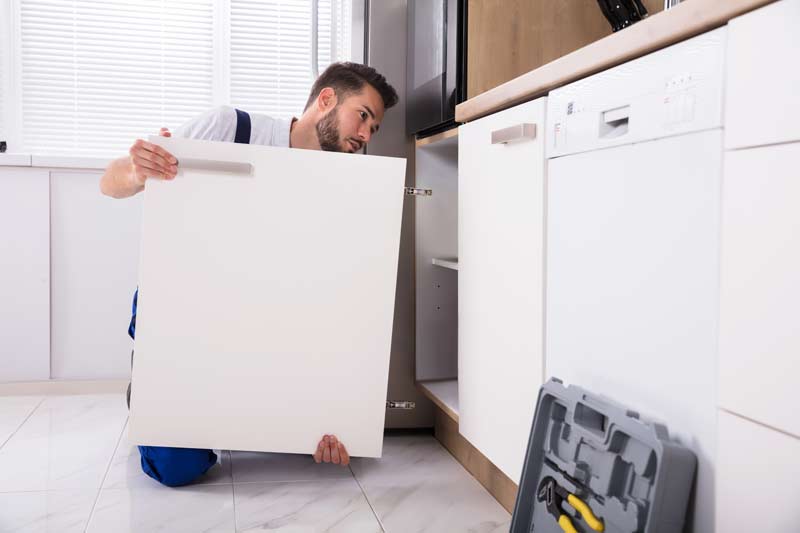 homeguide handyman removing kitchen cabinet door thumbnail